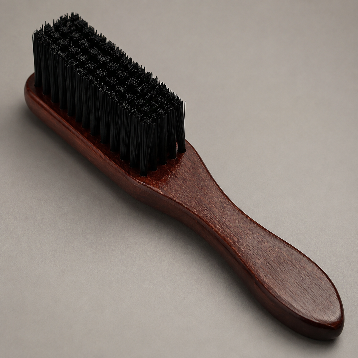 Close detail of the Bymace fade brush wooden handle and black bristles