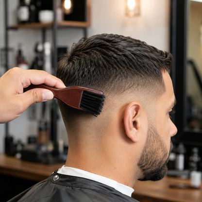 Barber using a Bymace wooden fade brush during a fade