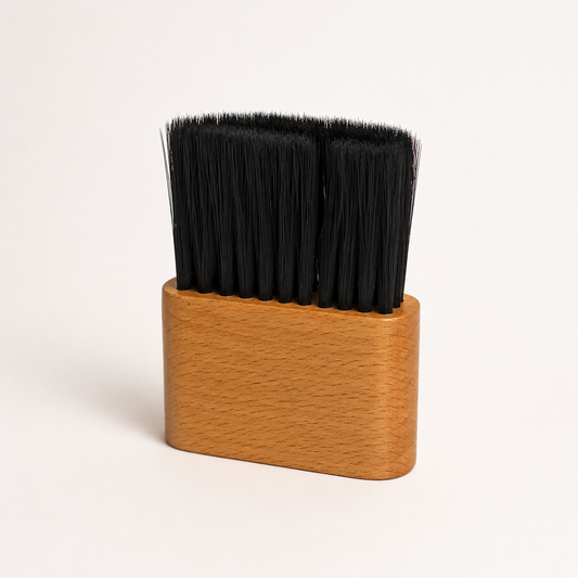 Bymace X2217 wooden neck duster with dense black bristles on a warm-white studio background