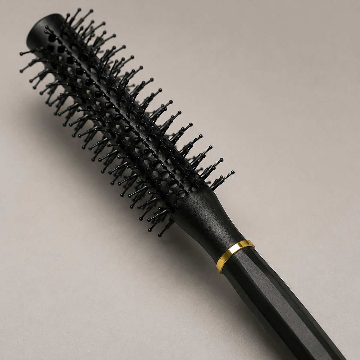 Close detail of the black round brush vented barrel, ball-tipped pins and gold-tone collar