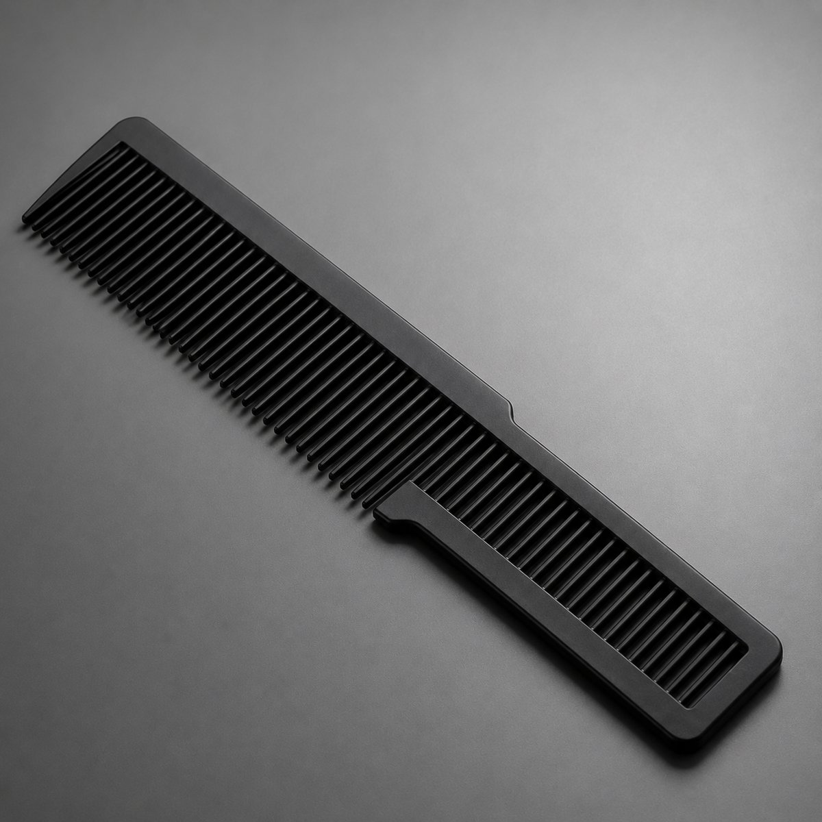 Close detail of black carbon hair comb teeth and open handle