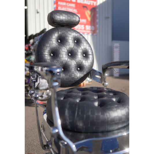 Chrome LV barber chair black checkered backrest, headrest and safety strap detail