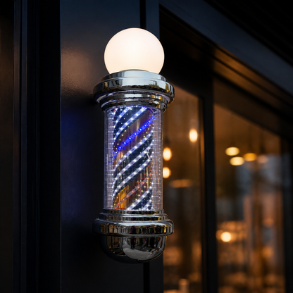 Chrome LED Barber Pole with Globe – 88 x 23cm displayed at a barbershop at dusk