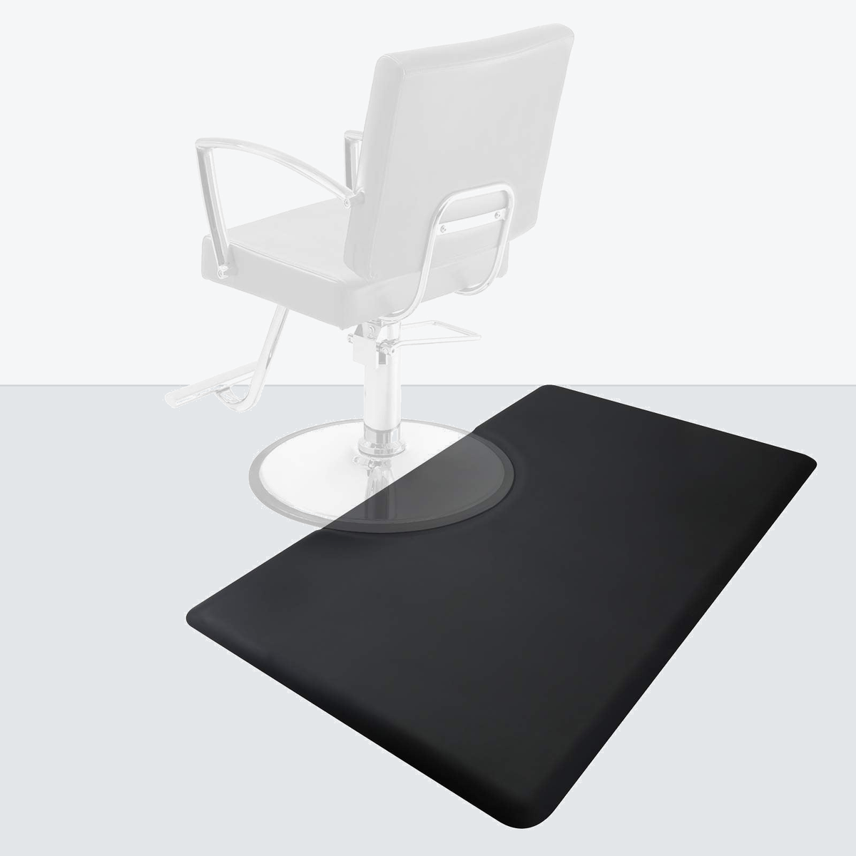 Black 150 x 90cm salon station floor mat beneath a barber chair