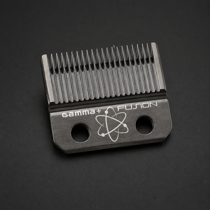 Gamma+ Fusion fixed clipper blade with two mounting holes on a dark studio surface