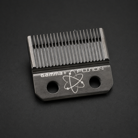 Gamma+ Fusion fixed clipper blade with two mounting holes on a dark studio surface