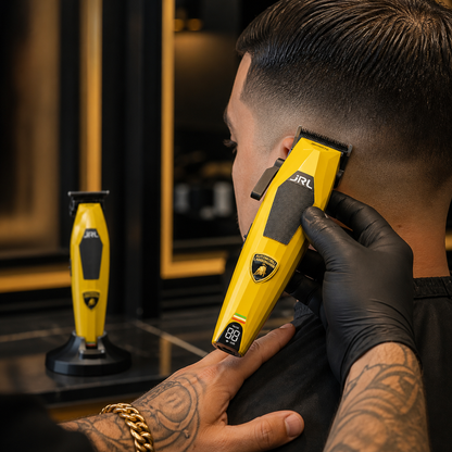 Barber using the yellow JRL x Lamborghini Diamante clipper for a fade