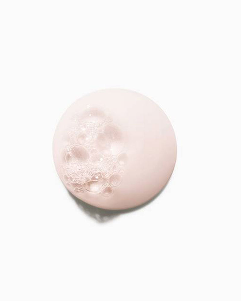 Close-up of Kérastase Bain Chroma Respect shampoo lather swatch