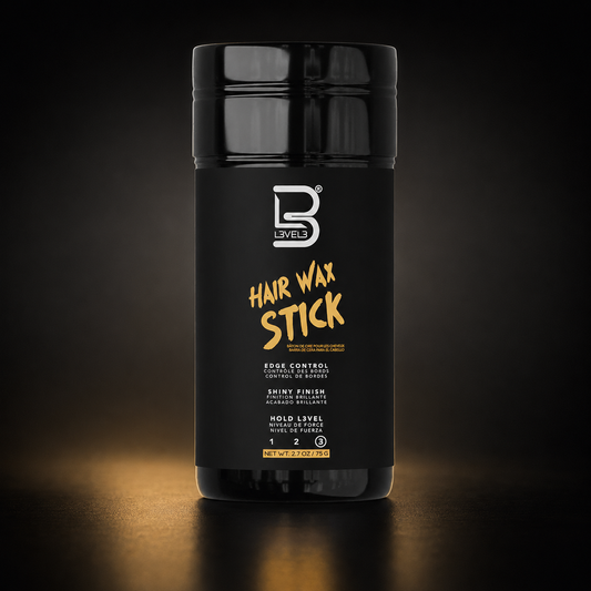 L3VEL3 Hair Wax Stick 75g on a black and gold studio surface