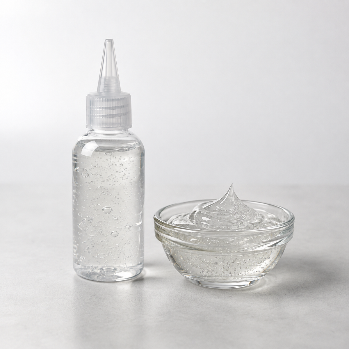 Activated Malibu C Crystal Gel XL in applicator bottle with clear gel sample