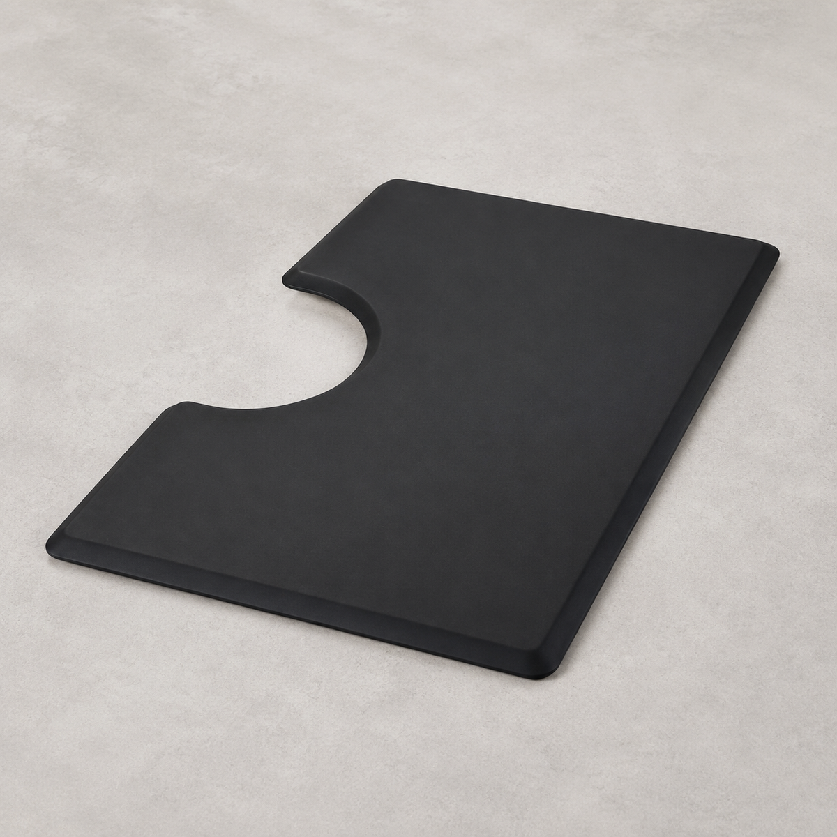 MV black rectangular anti-fatigue mat with semicircular chair-base cutout