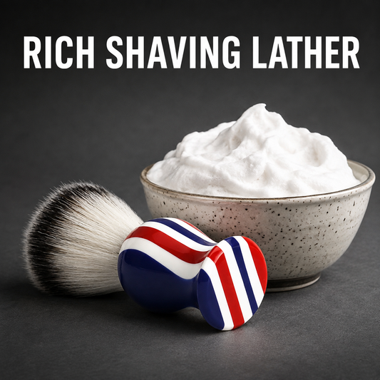 Barber-pole shaving brush beside a bowl of rich shaving lather with benefit text
