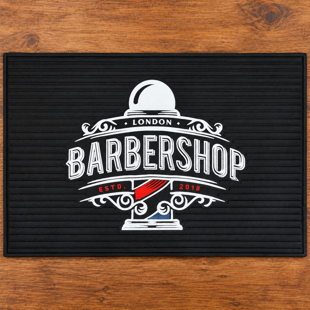 MV Barbershop London Barber Tool Mat – Black shown alone on a wooden workstation