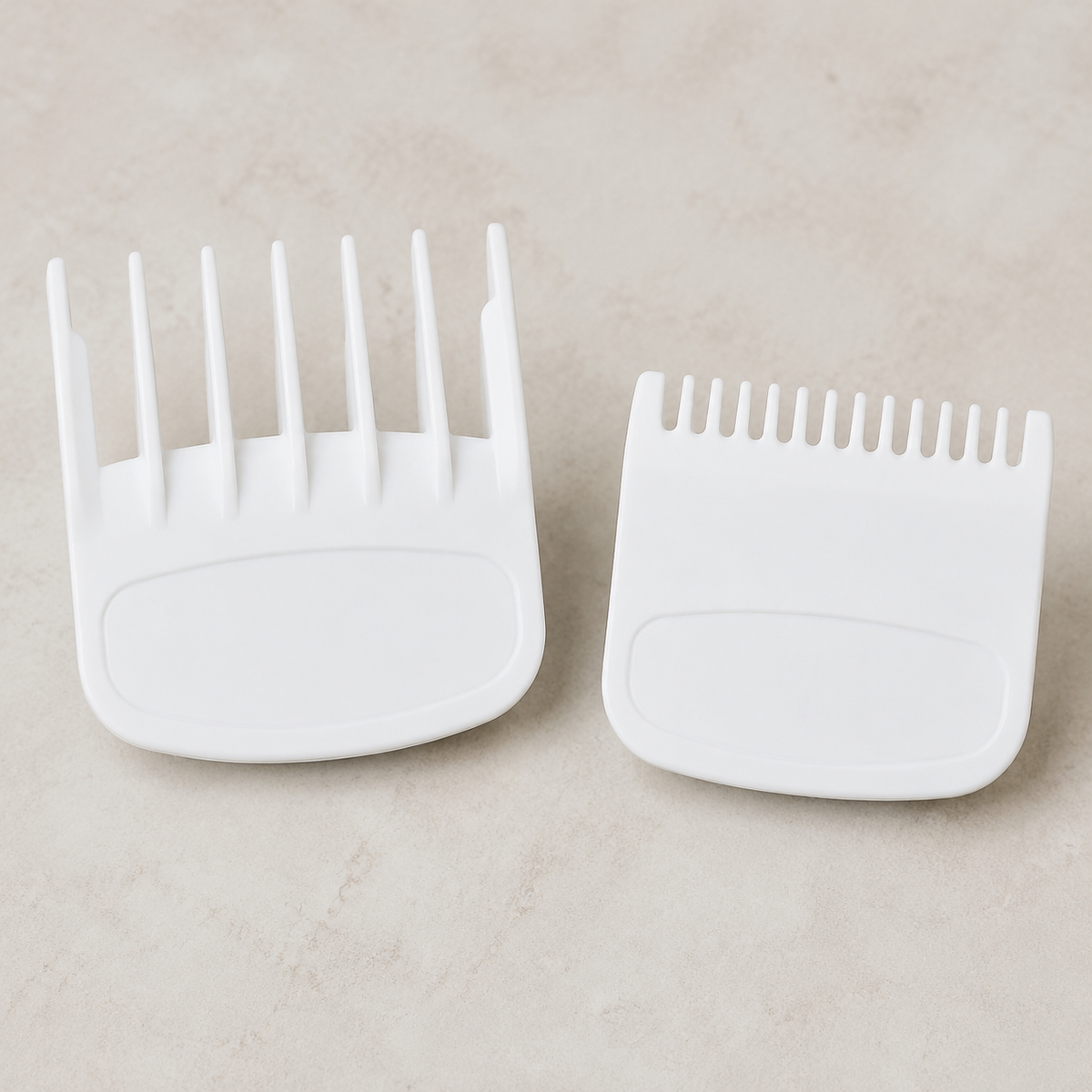 White 0.5 and 1.5 clipper guide combs shown side by side