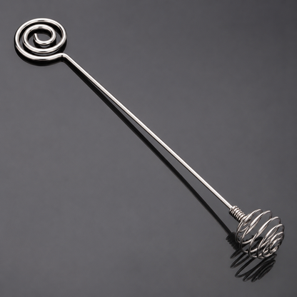 Close detail of the two spiral ends on a stainless steel mixing stick