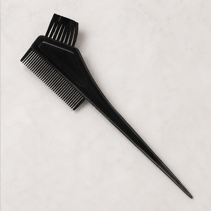 Close view of black HS tint brush with comb, bristles and pointed sectioning tail