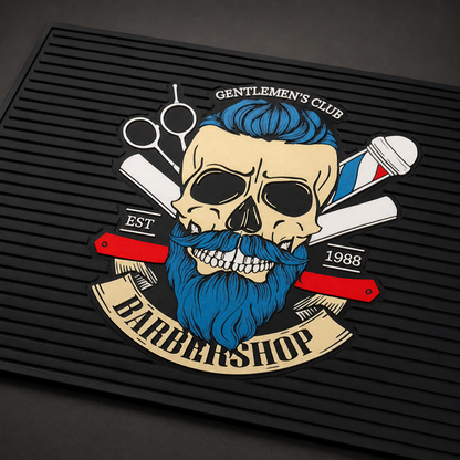 Close detail of blue-haired skull artwork on the black barber tool mat