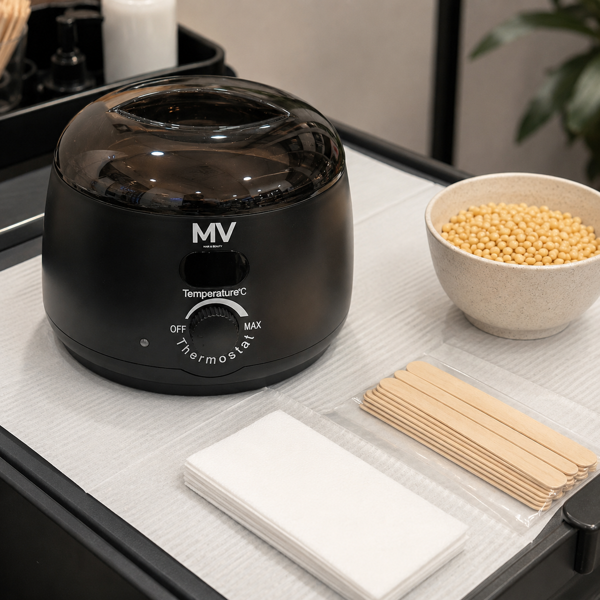 MV Wax Heater arranged on a salon trolley with wax beads, spatulas and strips