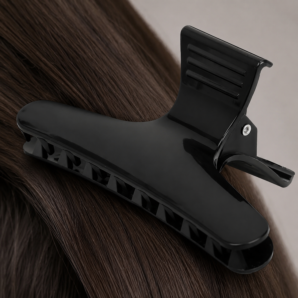 Close detail of wide black hair clip jaw, grip teeth and lever