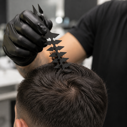 Barber using the black styling comb to lift short dark hair