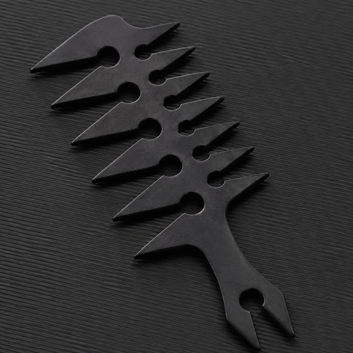 Close detail of the Barber Styling Comb triangular teeth and cut-outs