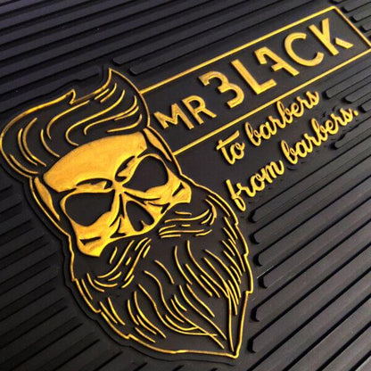 Close detail of Mr Black bearded-skull barber tool mat