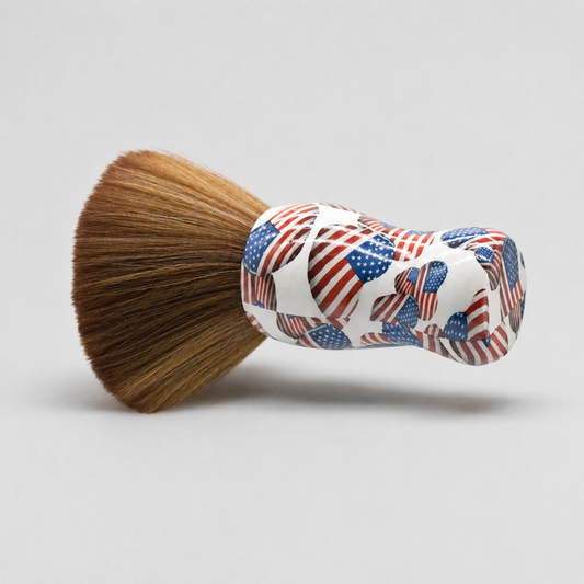 USA flag pattern barber neck brush with brown bristles on a light grey studio background