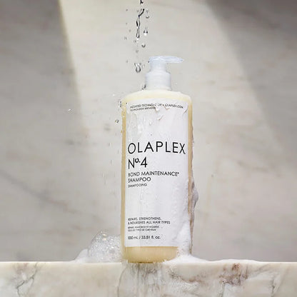 OLAPLEX No.4 Bond Maintenance Shampoo 1000ml bottle with water