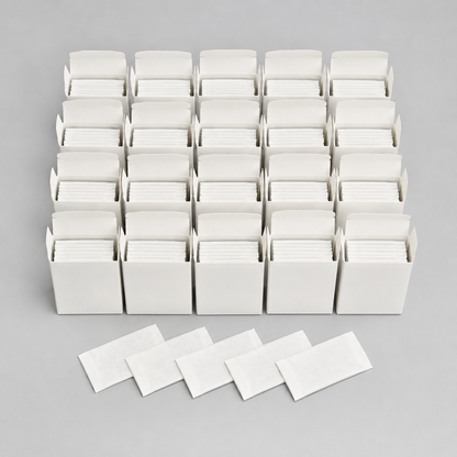 Twenty five-blade tucks and five wrappers representing the 100-blade pack