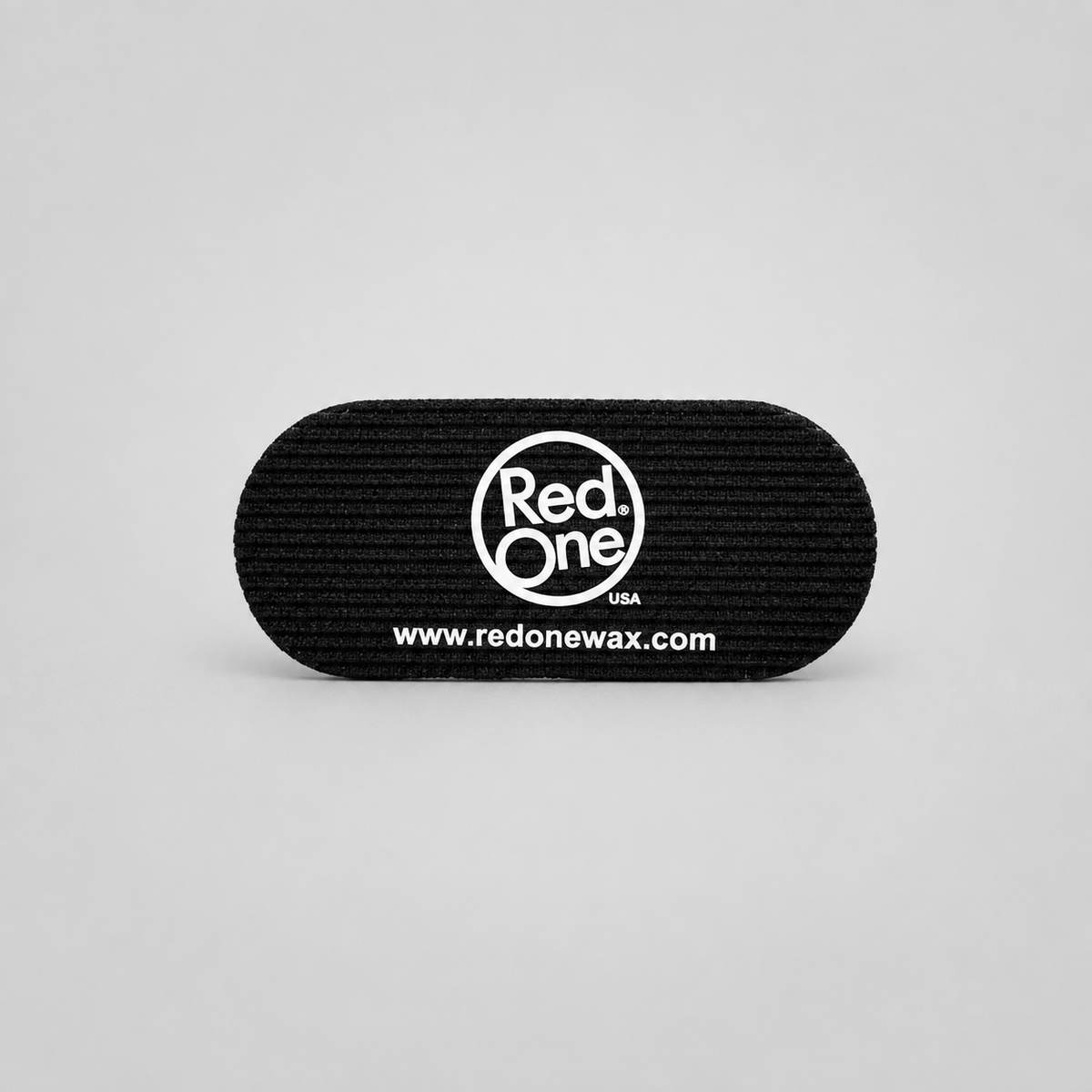 RedOne black fabric hair grip with white logo