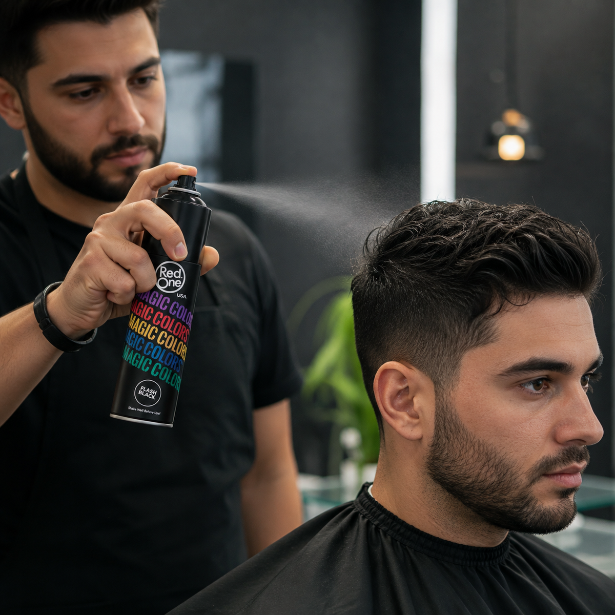 Stylist applying RedOne Magic Colour Flash Black 100ml spray to dry hair