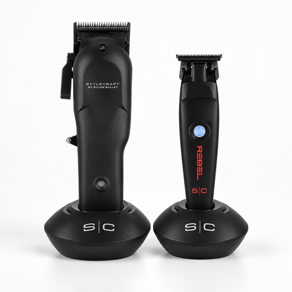 StyleCraft Rebel clipper and trimmer in black charging stands on a light studio background