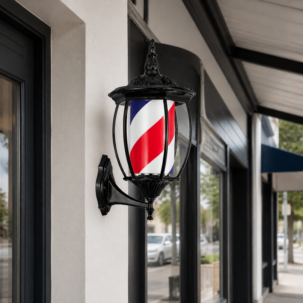 Vintage Black Rotating Barber Pole – Red, White & Blue 49cm installed on a modern barbershop exterior