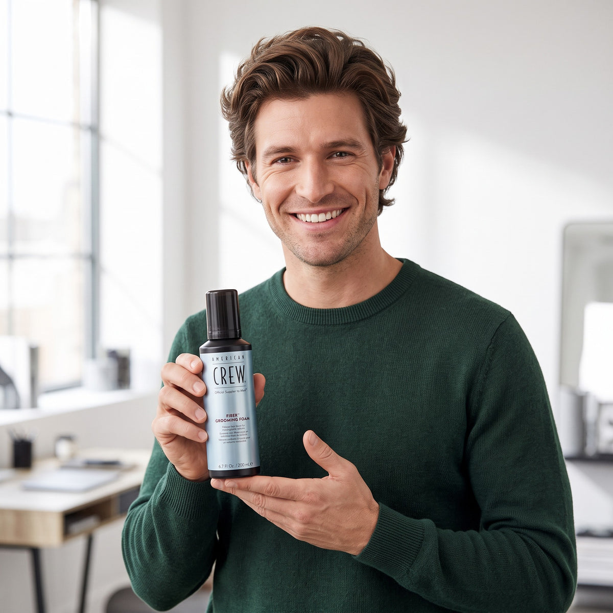 Smiling man holding American Crew Fiber Grooming Foam