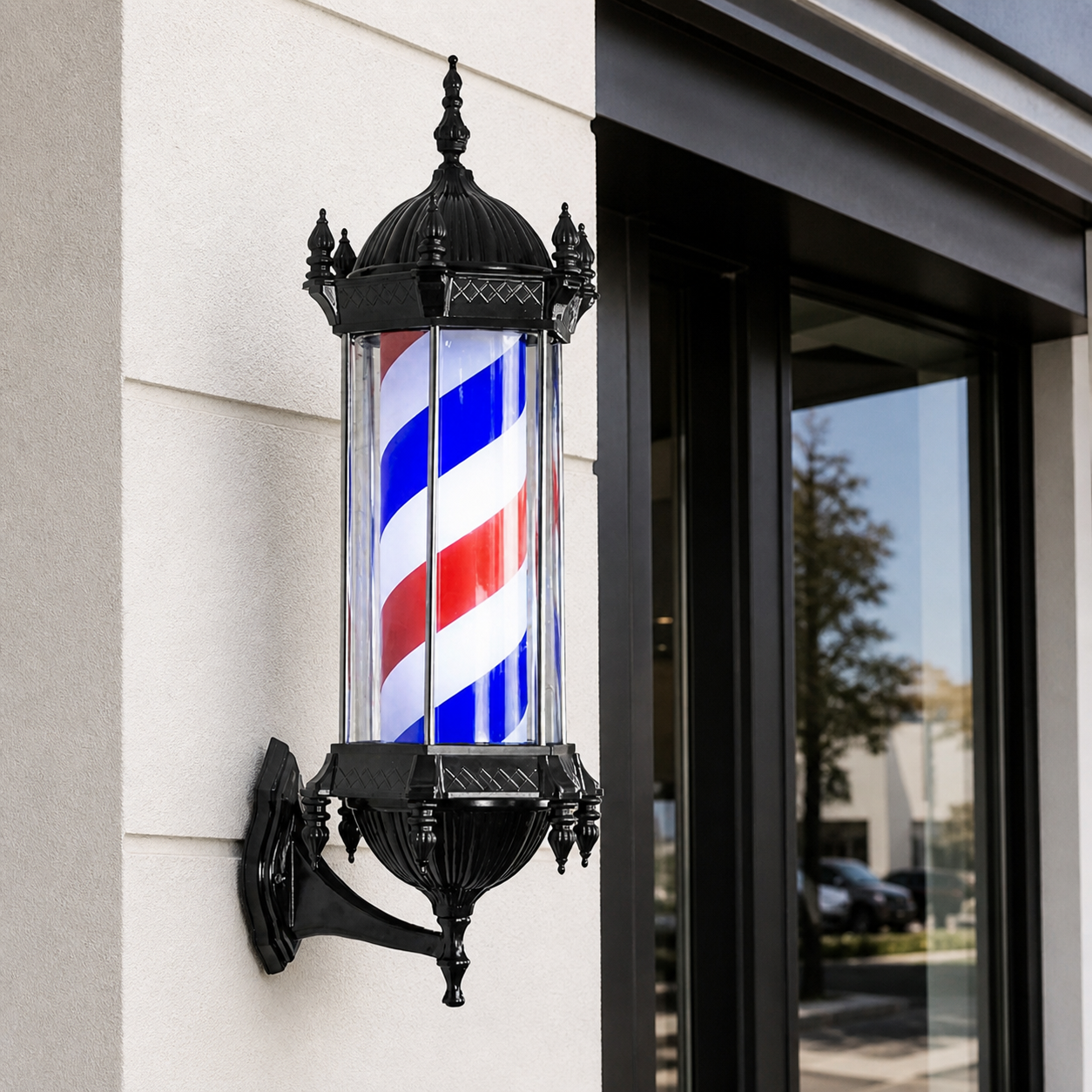 Black LED Rotating Barber Pole – Red, White & Blue installed on a modern barbershop exterior