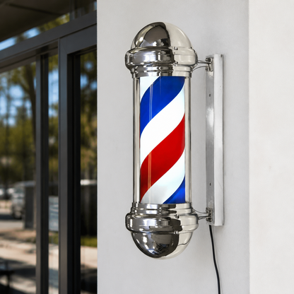 Chrome Rotating Barber Pole – 23cm Wide installed on a modern barbershop exterior