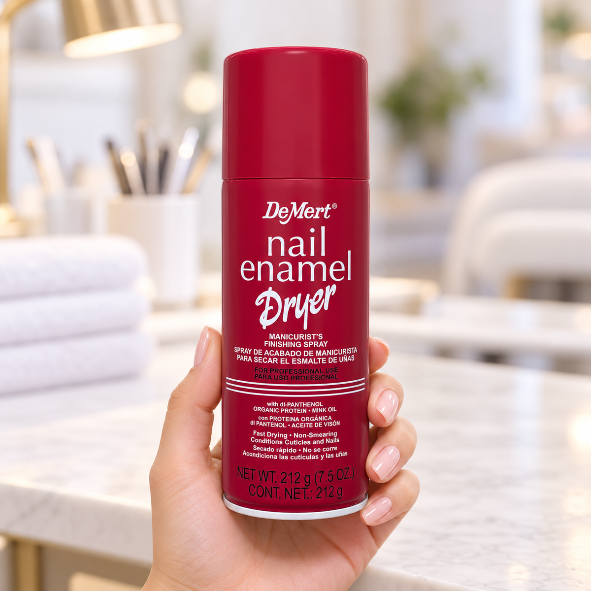 DeMert Nail Enamel Dryer Spray 212g held upright with the cap on and front label visible