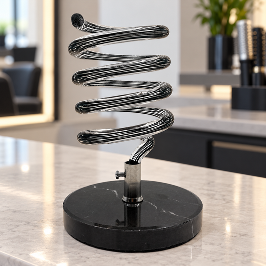 Black MV spiral hair dryer holder on a salon counter, shown empty.