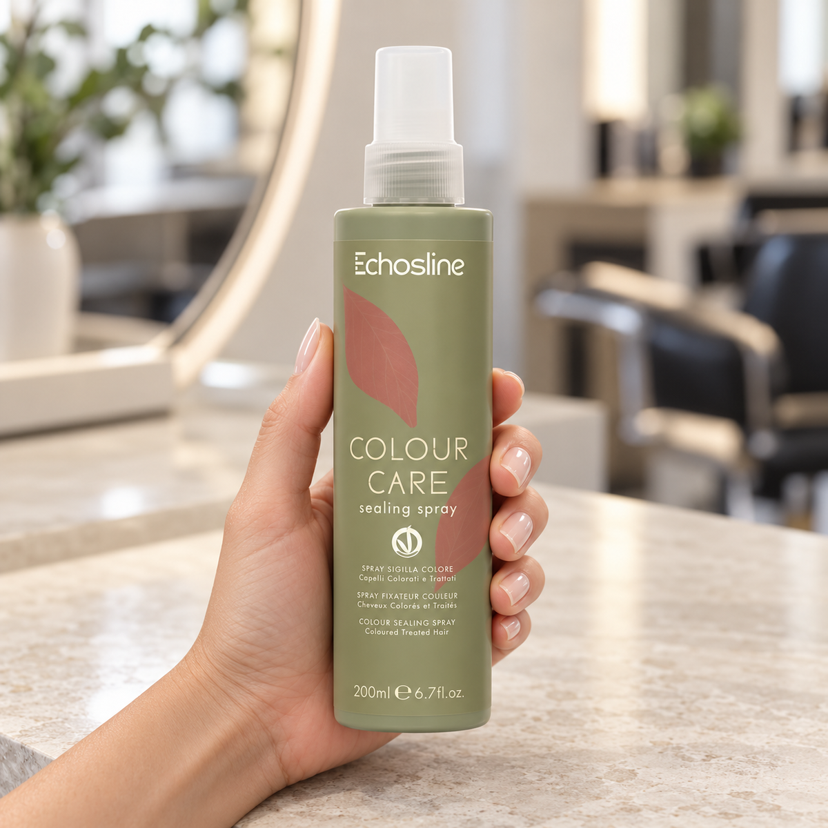 Echosline Colour Care Sealing Spray 200ml held upright at a salon workstation.