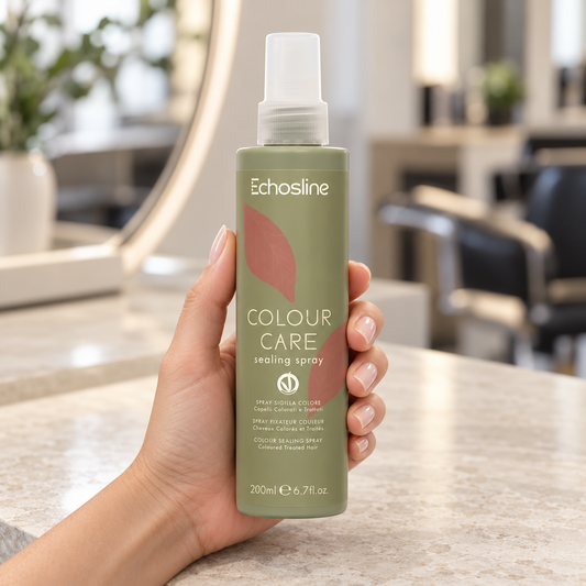 Echosline Colour Care Sealing Spray 200ml held upright at a salon workstation.