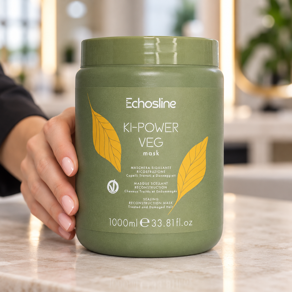 Echosline Ki-Power Veg Mask 1000ml tub held upright on a salon counter.