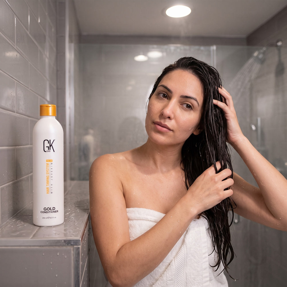 GK Hair Gold Conditioner 250ml being used in a salon