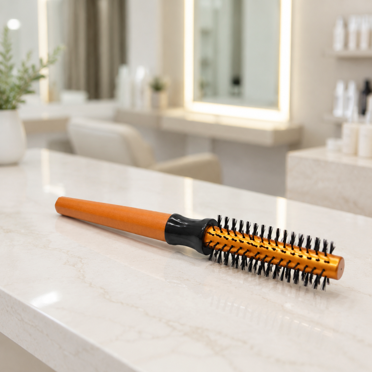Gold Round Hair Brush 13mm on a professional salon counter