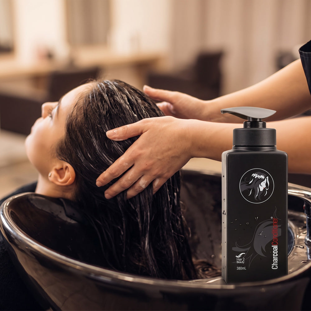 Hair 2 Beauty Charcoal Conditioner being used in a salon