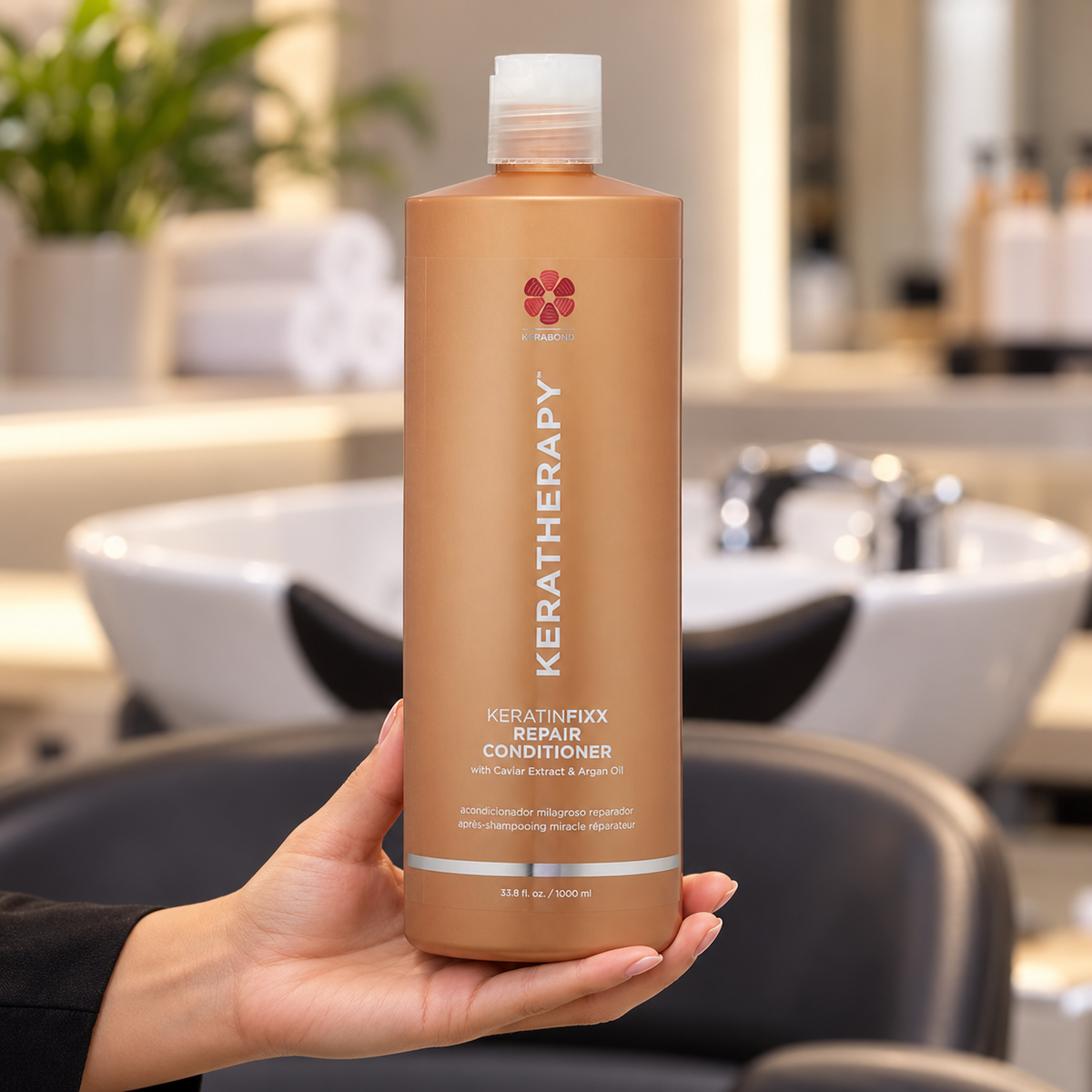 Keratherapy KeratinFixx Repair Conditioner 1L held upright in a salon, with the front label visible.