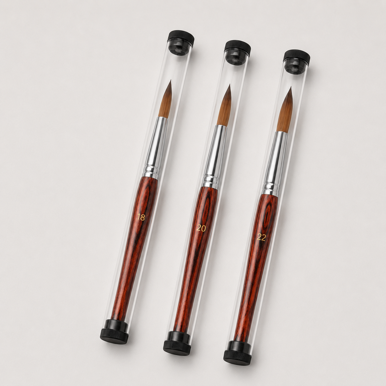 Kolinsky Stable Brushes sizes 18, 20 and 22 arranged in clear protective tubes