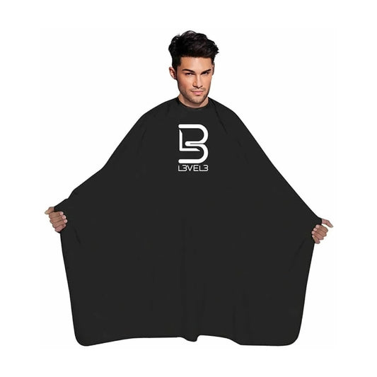 L3VEL3 black barber cape, universal size with adjustable neck closure, worn by a model - MV hair and beauty
