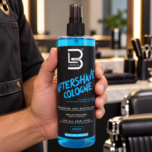 L3VEL3 Aqua Aftershave Cologne 400ml held at a barber station.
