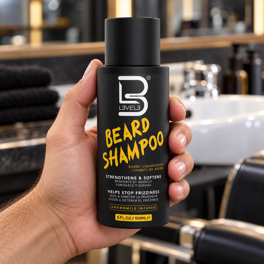 L3VEL3 Beard Shampoo 150ml held upright at a barber wash station.