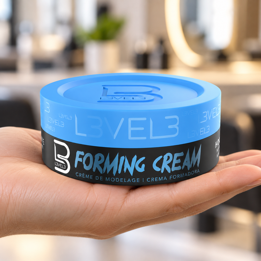 L3VEL3 Forming Cream 150ml with blue lid supported in a hand.